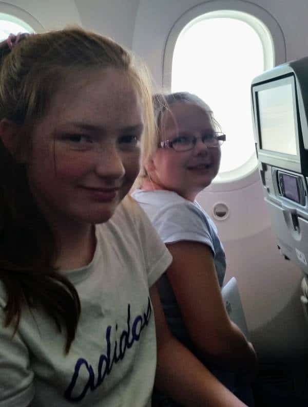 two kids flying Qatar