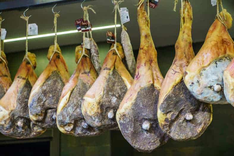 spanish ham hanging in a butcher
