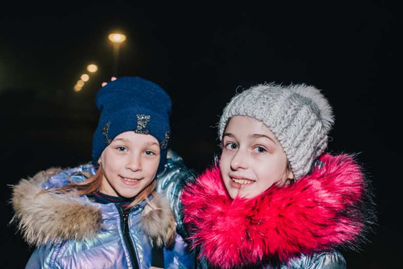 2 young girls on holiday in Iceland dressed in warm clothes