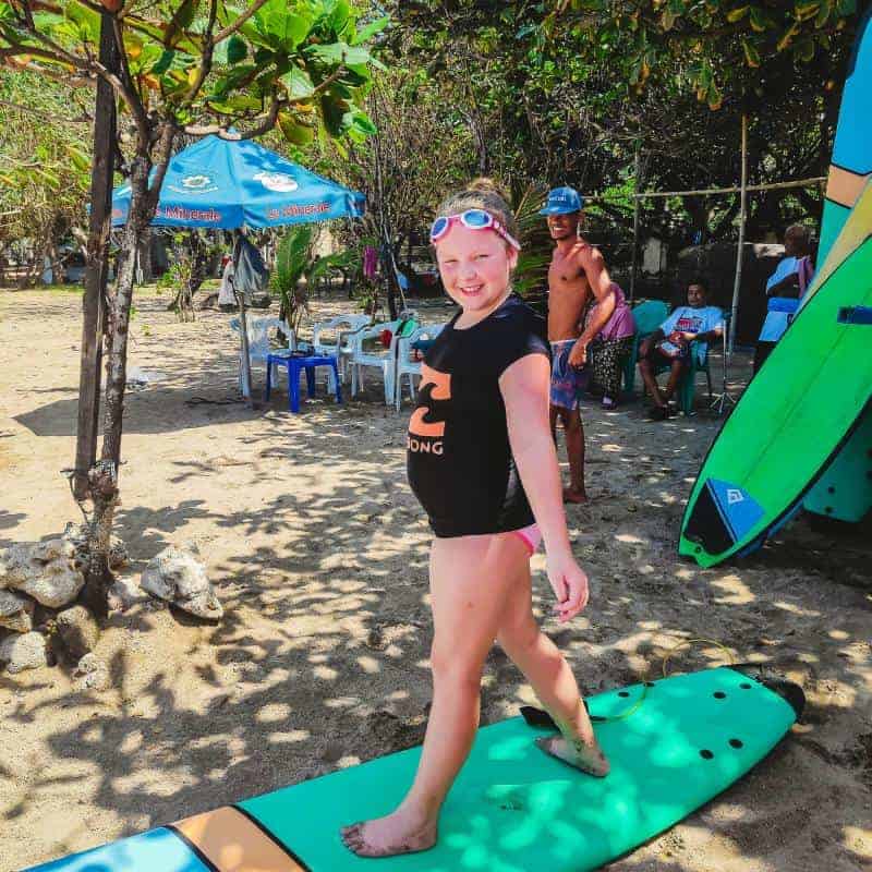 learning to surf at Kuta beach Bali