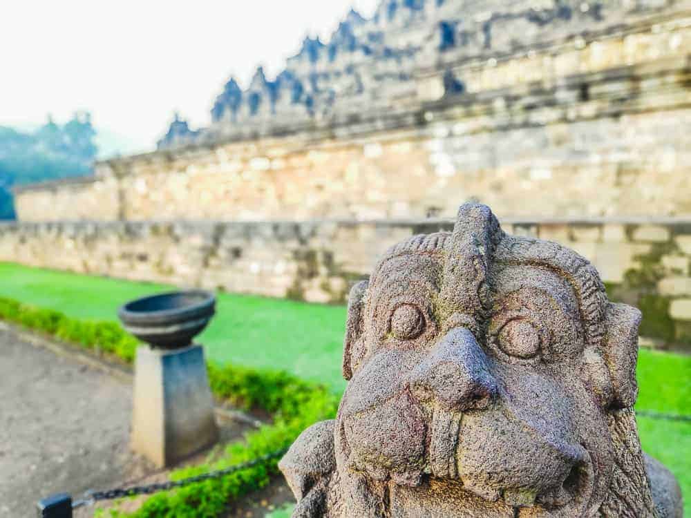 One of the many buddust stautues at the Borobudur site