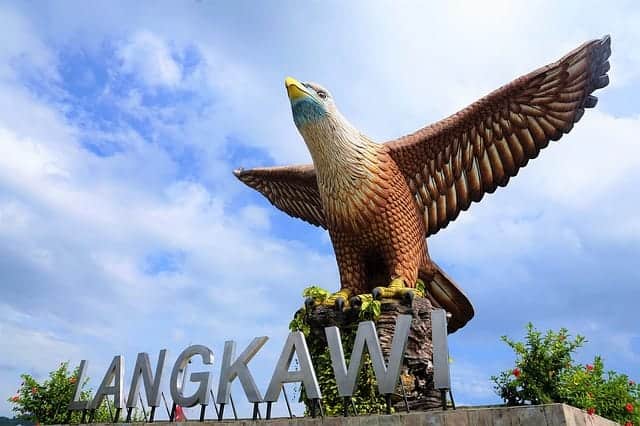 The large eagle statue stands tall with the words Langkawi below it in silver. The eagle has its winds outstretched and it's talons gripping around a large rock