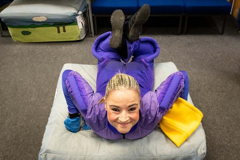 a young adult getting ready to go indoor skydiving