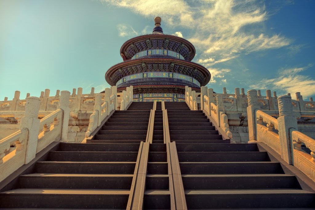 Dynamic urban scene in Beijing, China, featuring bustling streets, colorful signage, and a lively atmosphere.