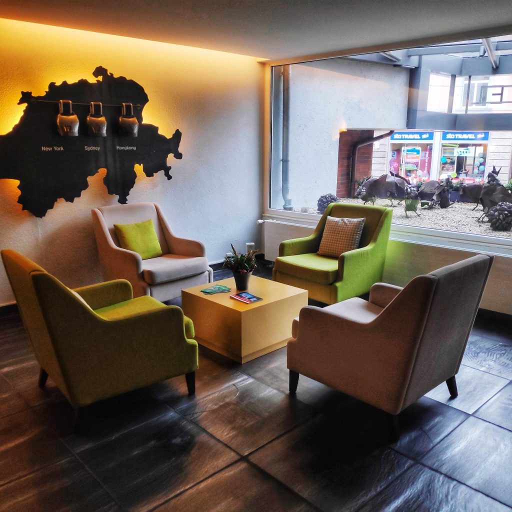 The foyer at zurich hotel with chairs and table