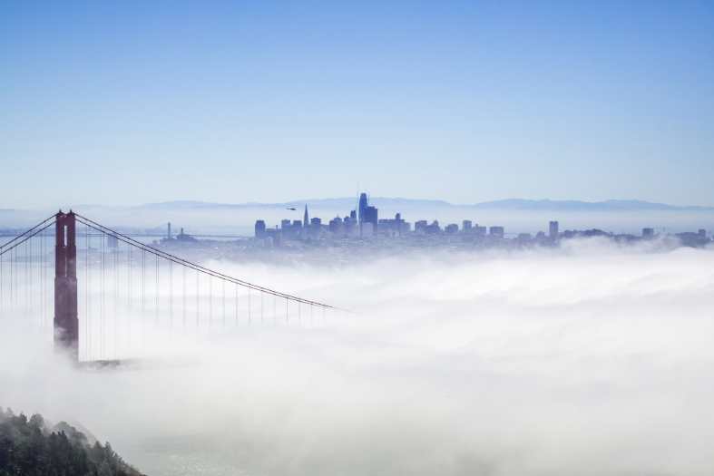 the city of sna francisco covered in cloud as seenf rom a helicopter