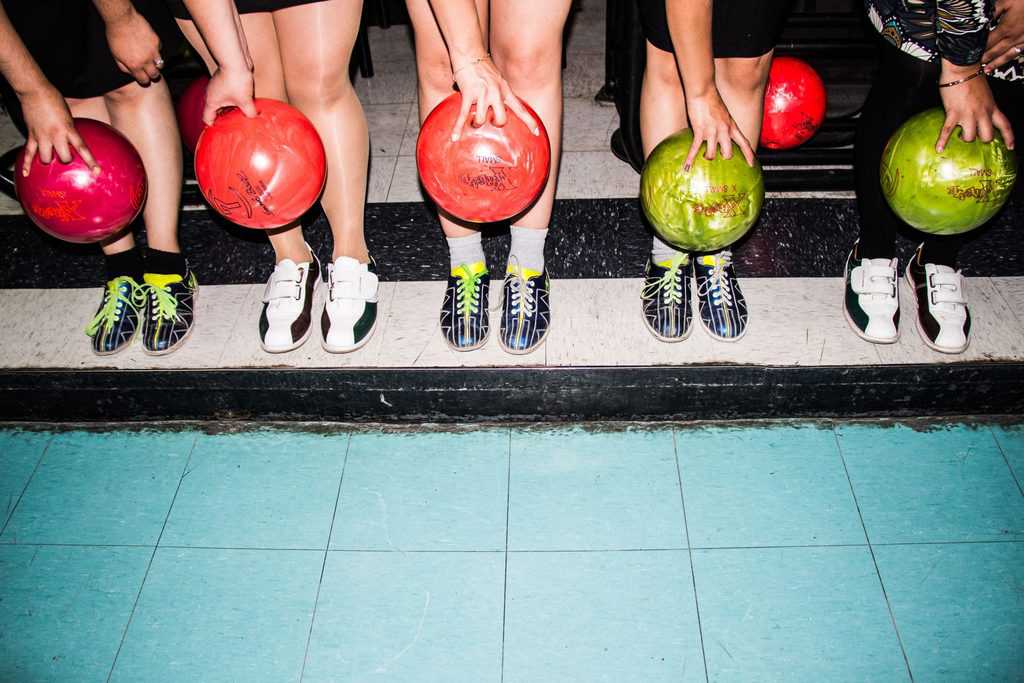 holding a bowling ball