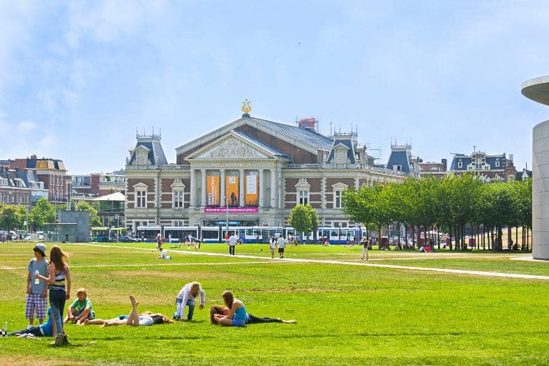 teens enjoying a sunny day in Amsterdam in a park