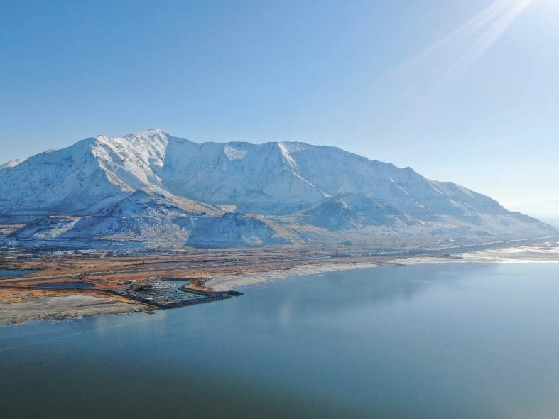 The Great Salt Lake in Utah with mountains in the back ground and a marina on the lake