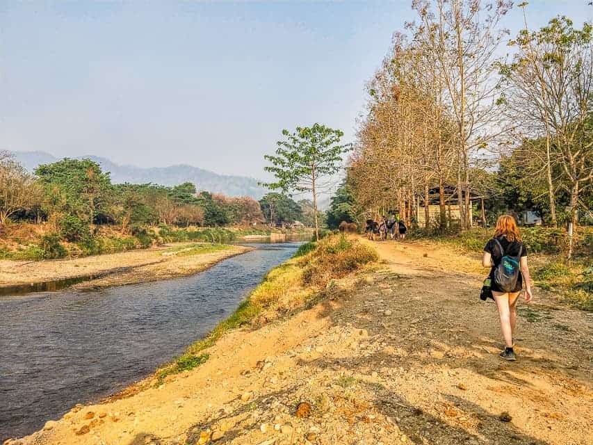 Walking along the river at Elephant Nature Park