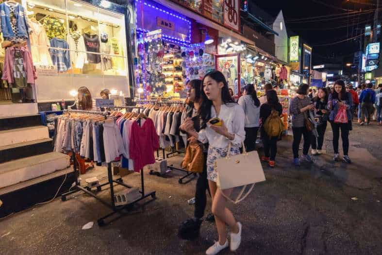 young adults out shopping in Seoul at night time