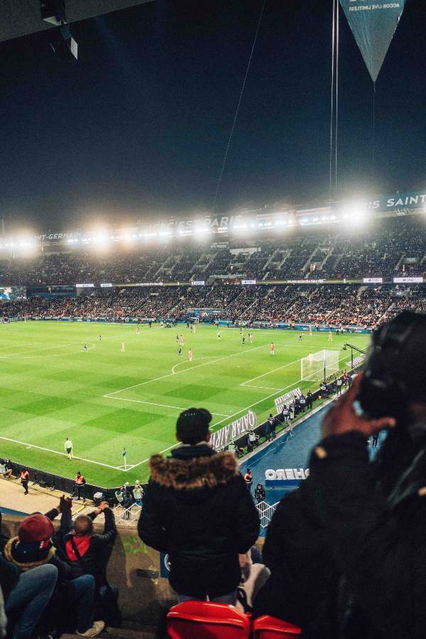 a crowd in the stadium Parc des Prince watching a PSG match in Paris