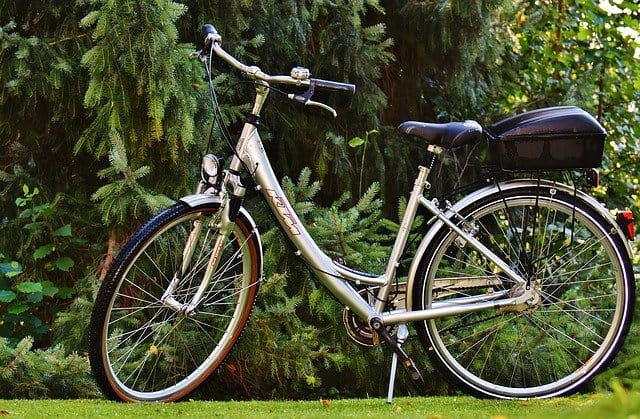 A white bike with a basket on the back is a perfect way to get around with teenagers in strasbourg