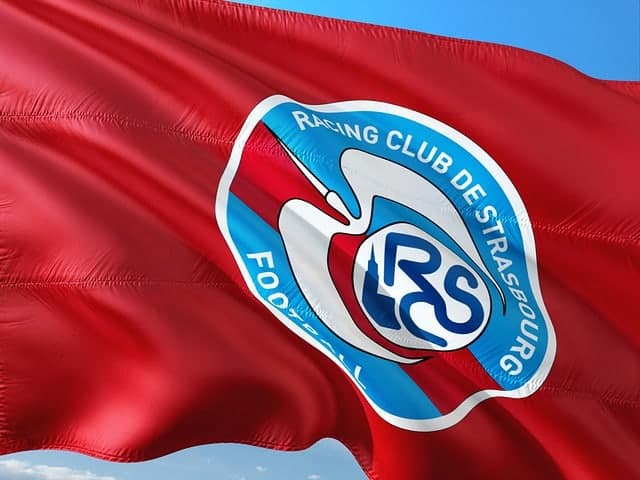 The red white and blue flag of the local football club in Strasbourg flapping in the breeze