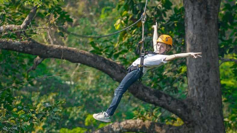 a young girl having fun on the angkor zipline