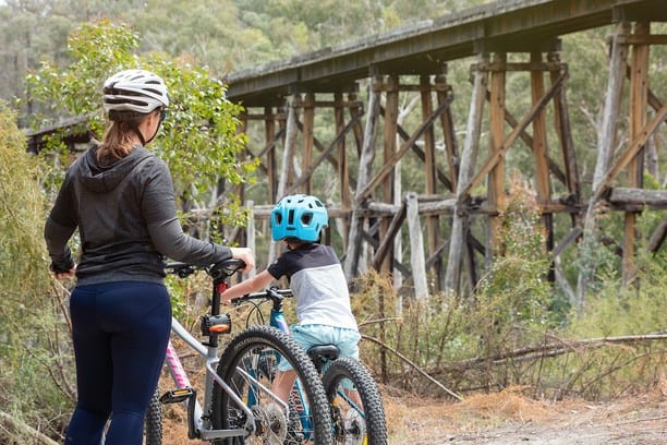 two teenagers passing on the Stony Creek Trestle Bridge, Gippsland