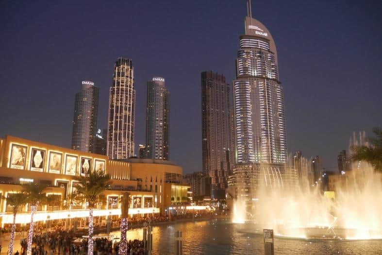 a lagoon in the city of Dubai with a fountain of lights