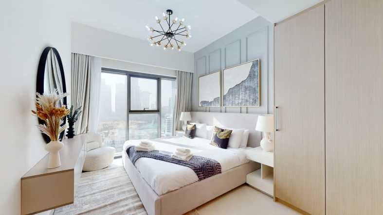 a fancy plum guide apartment in Dubai with a view of skyscrappers