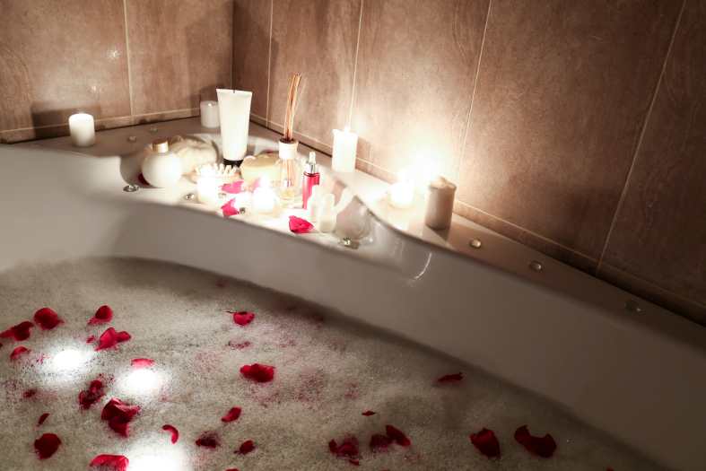 a romantic bath setup in a hotel room