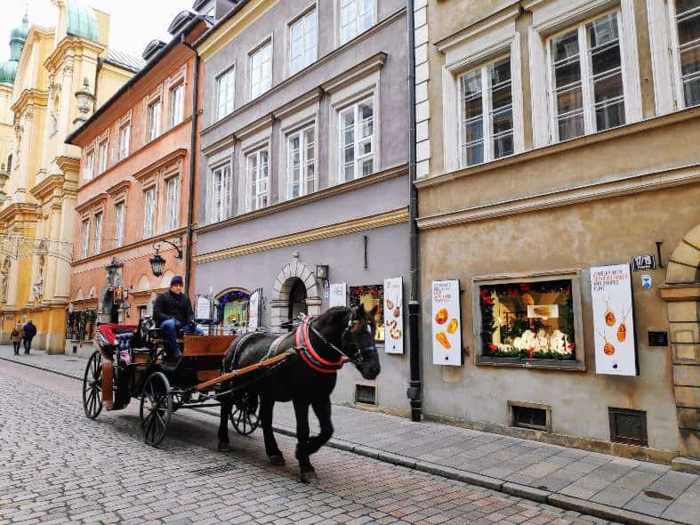 a horse drawn cart in the strrets of Warsaw Old Town