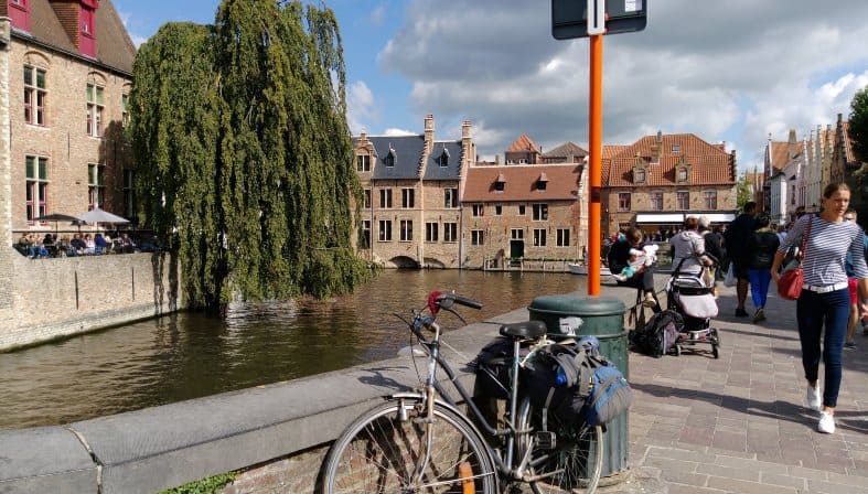 A bike parked on the river in Bruges