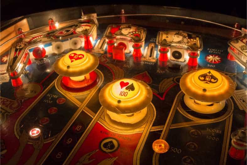 a classic pinball machine with lights and flippers