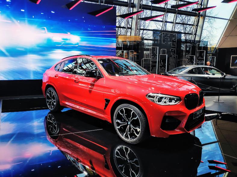 shinny red bmw on blue platform in Munich