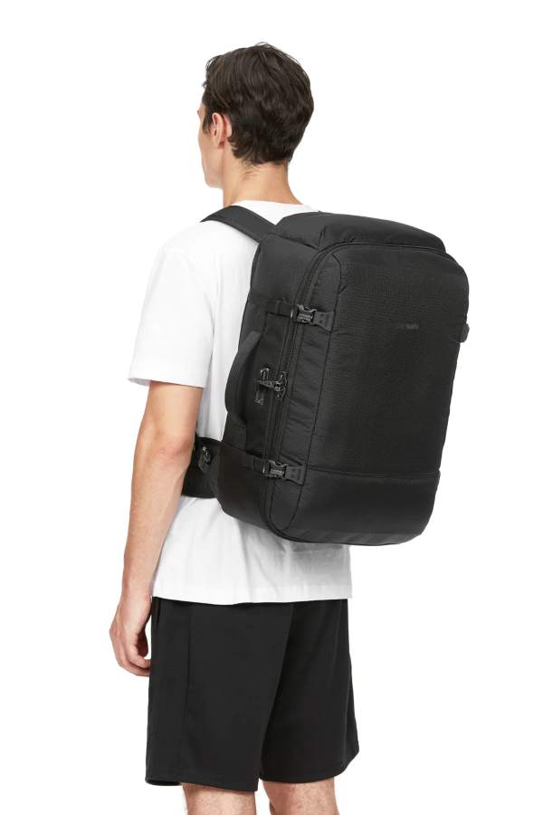 a teenage boy wearing an anti theft backpack