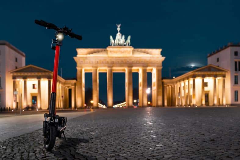 an e-scooter parked in Berlin neat the Brandenburg gate