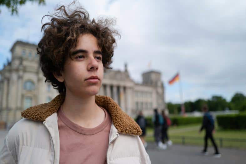 a teenage boy in Berlin near the parliment building