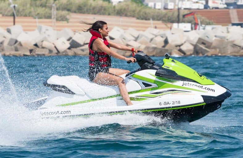 A teenage girl on a jet ski in Barcelona