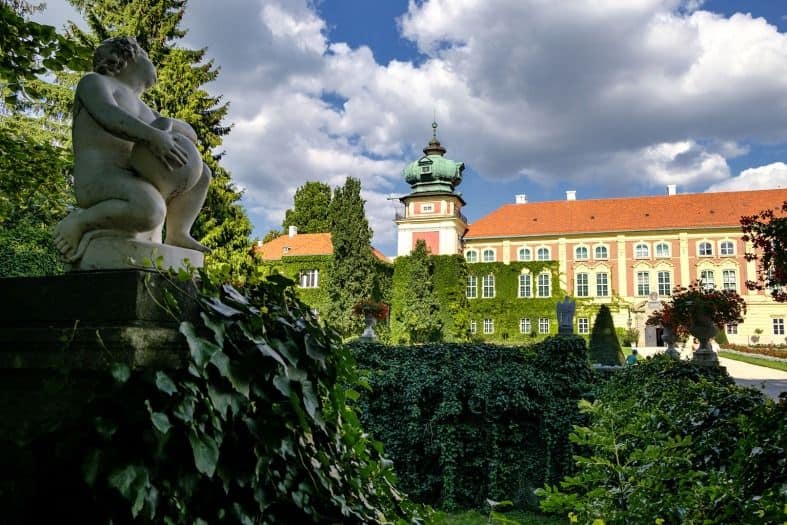 Gardens and statues at Lancut Castle in Poland