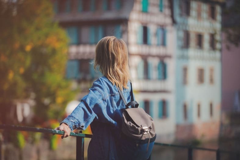 a teenager looking at the Strasbourg attractions