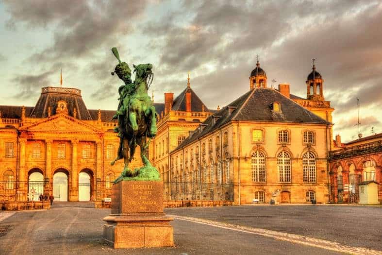 a statue out front of a castle in Luneville France