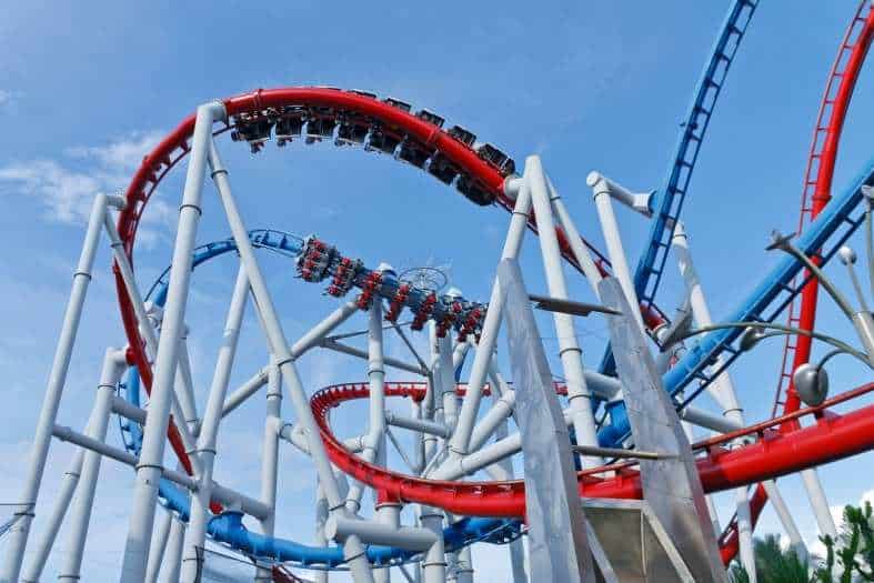 A vibrant and bustling scene at Universal Studios Singapore, with people enjoying thrilling rides and attractions known as the best things to do in Singapore with teenagers
