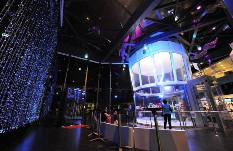 People watching indoor skydiving in Singapore