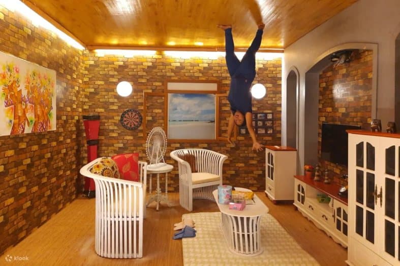 A teenager looking upside down in Bali