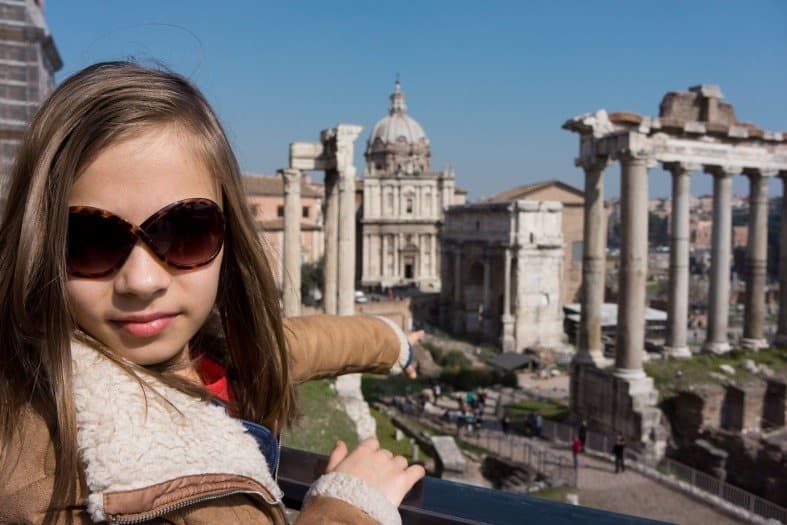 A teenage girl looking at historical sites at the Roman Forum