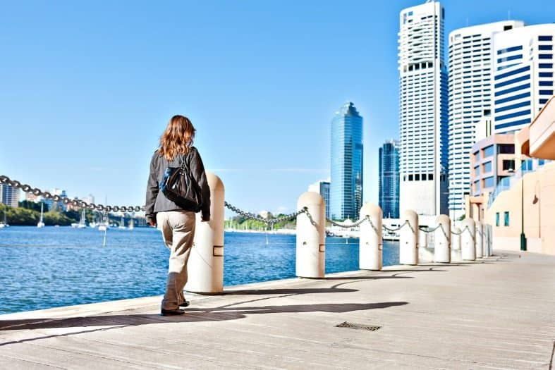 A teenager walking along South Bank in Brisbane