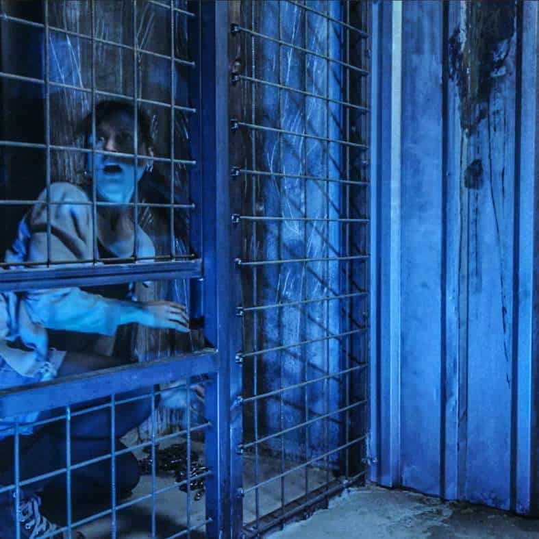 a teenagere being scared at the prague Dungeon