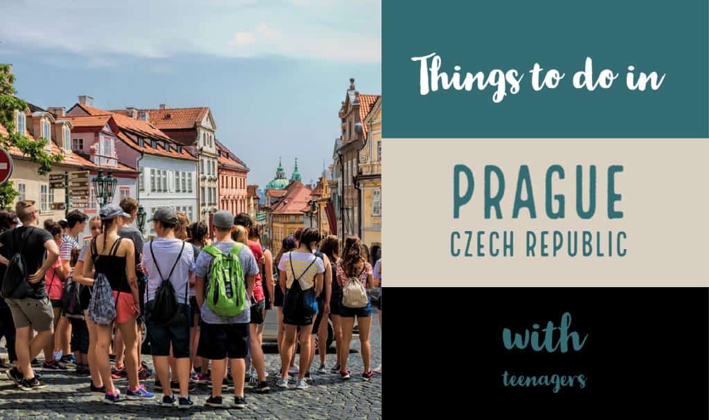 Teenagers on a tour listening to a guide in Prague