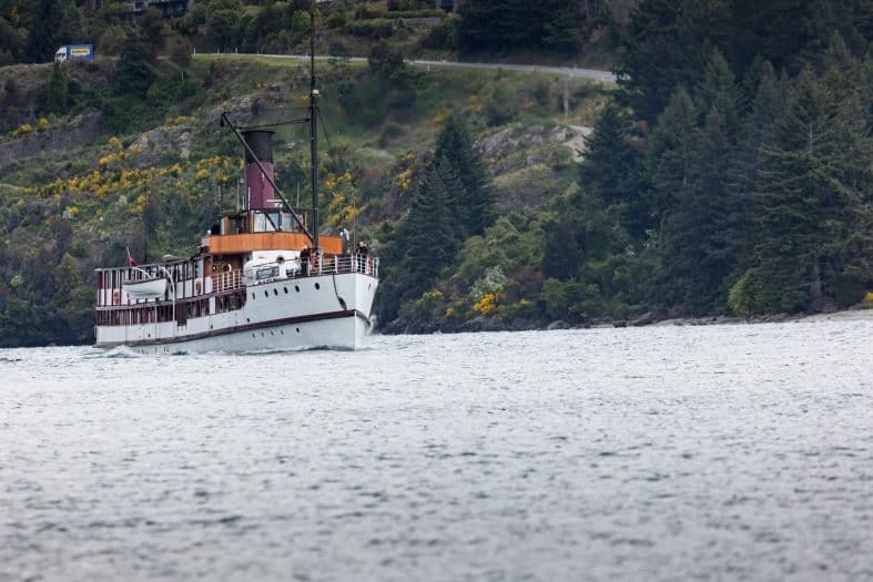 A boat cruising the waters of Lake Wakatipu.