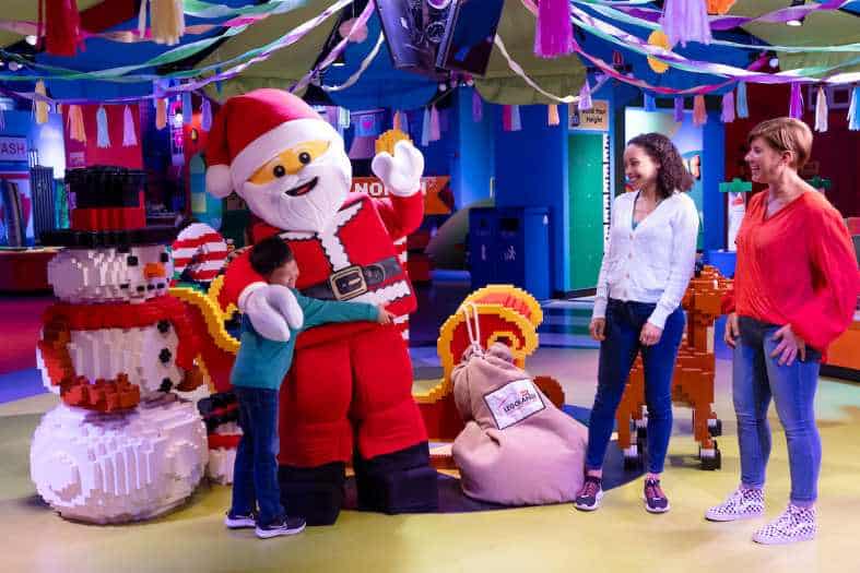 A family with tweens visiting the lego displays at lego discovery center in manchester