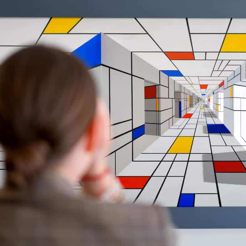 a teenage girl having fun in an illusion museum in prague