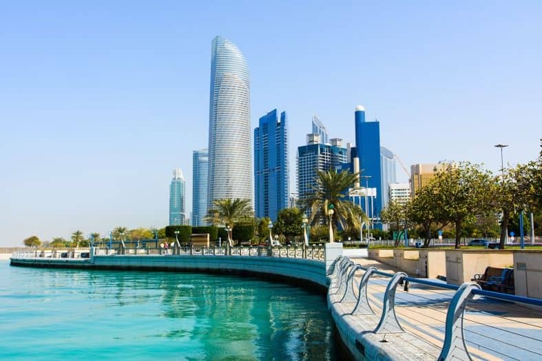 a boardwalk by the water in Abu Dhabi