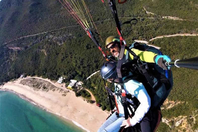 tandem paragliding above the beach in Portugal.