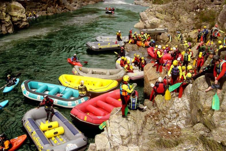 Thrilling white water rafting in Porto, Portugal surrounded by scenic landscapes