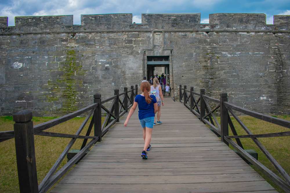 a tween exploring the castillo in St Augustine