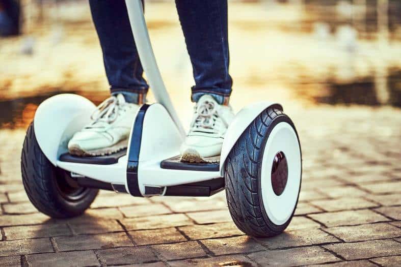 teenager gliding through the city on a Segway in Miami
