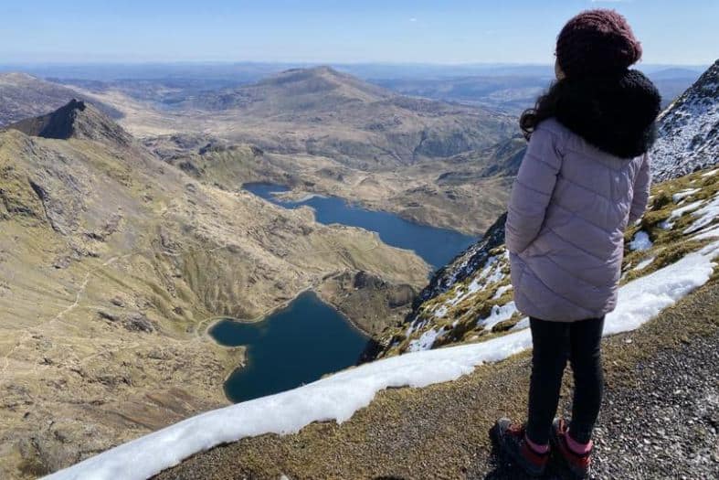 A teenager hiker enjoying a walk amidst the natural beauty of Snowdon